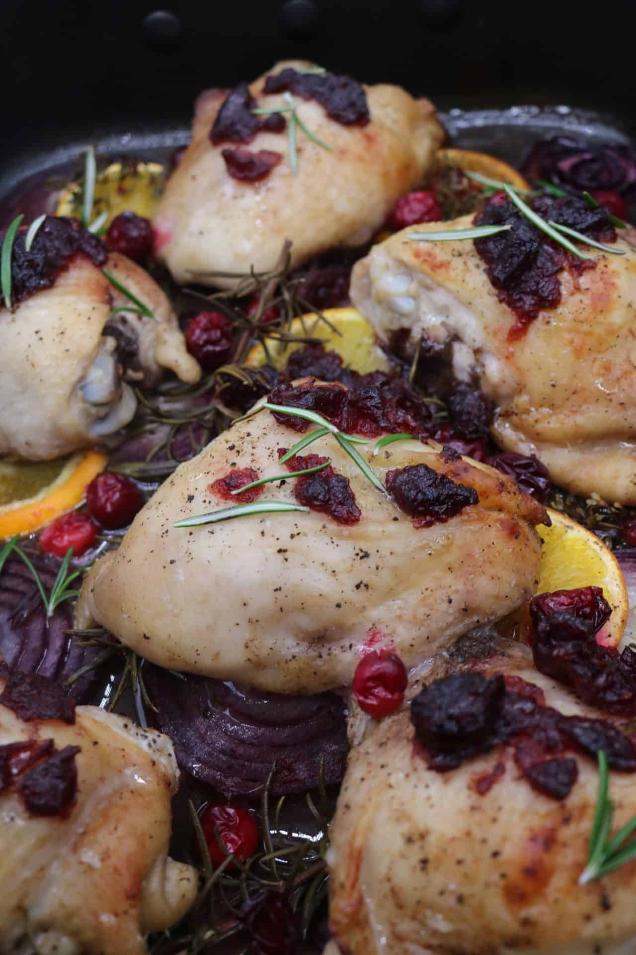 Close up of chicken cosmopolitan in large roasting tin