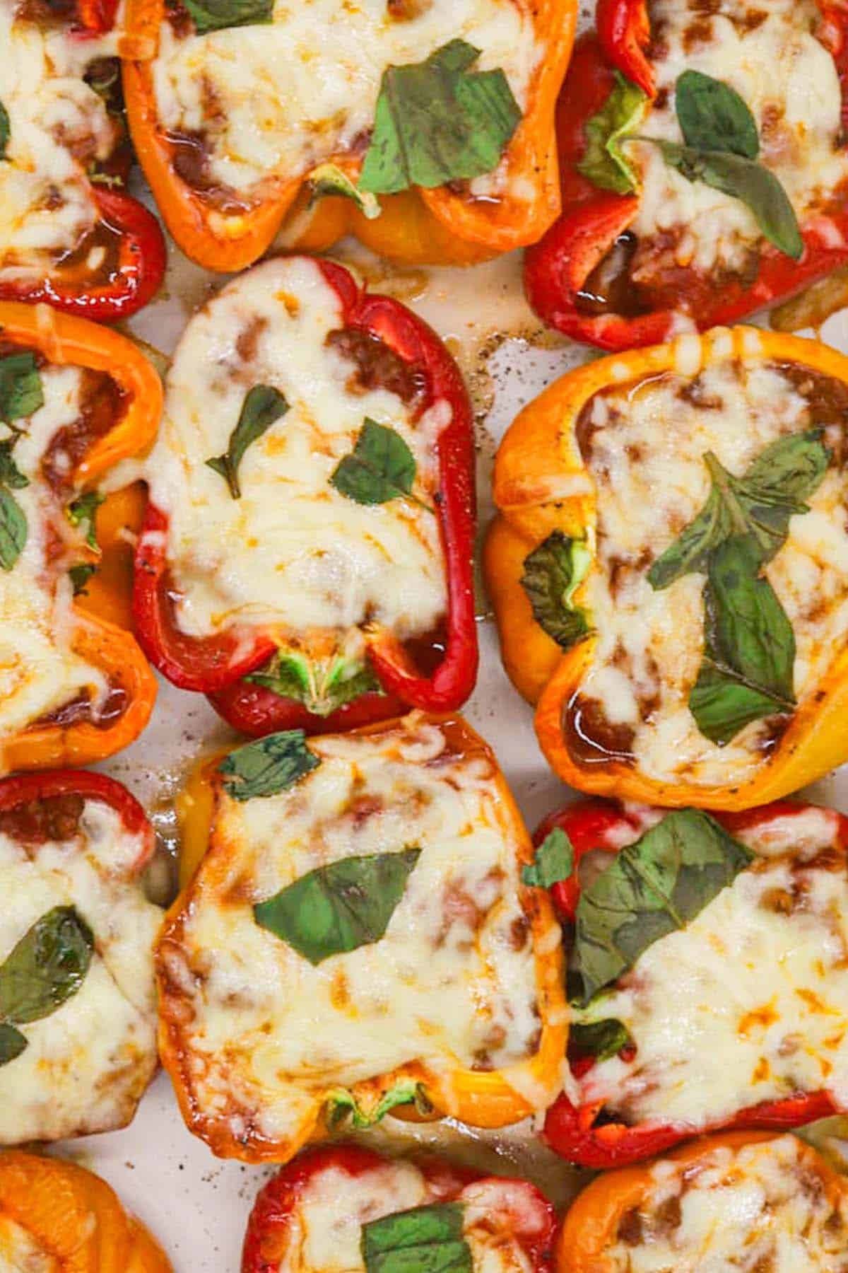 Close up of olognese stuffed peppers in large Staub rectangle oven dish.