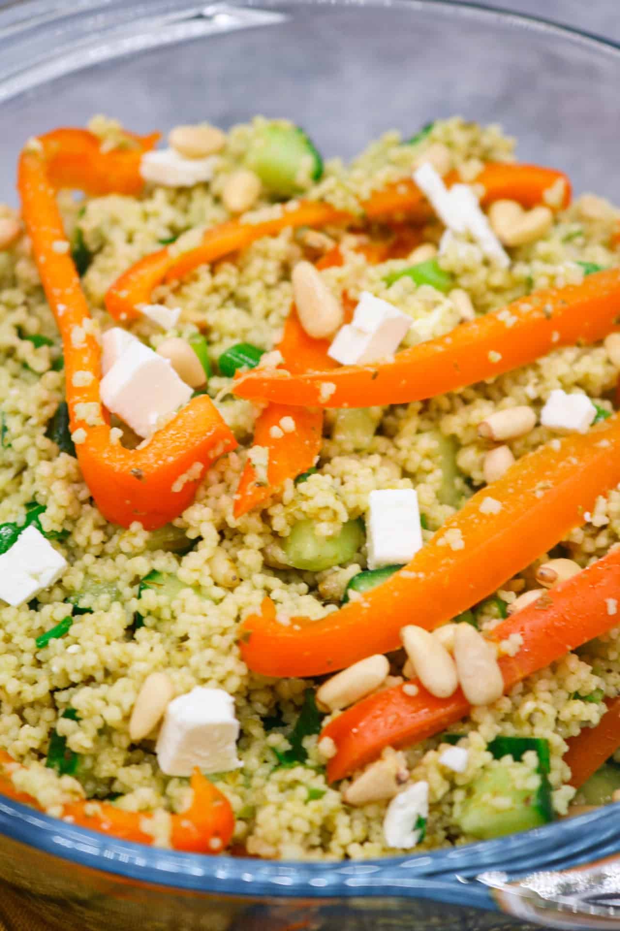 Couscous salad with feta in clear bowl