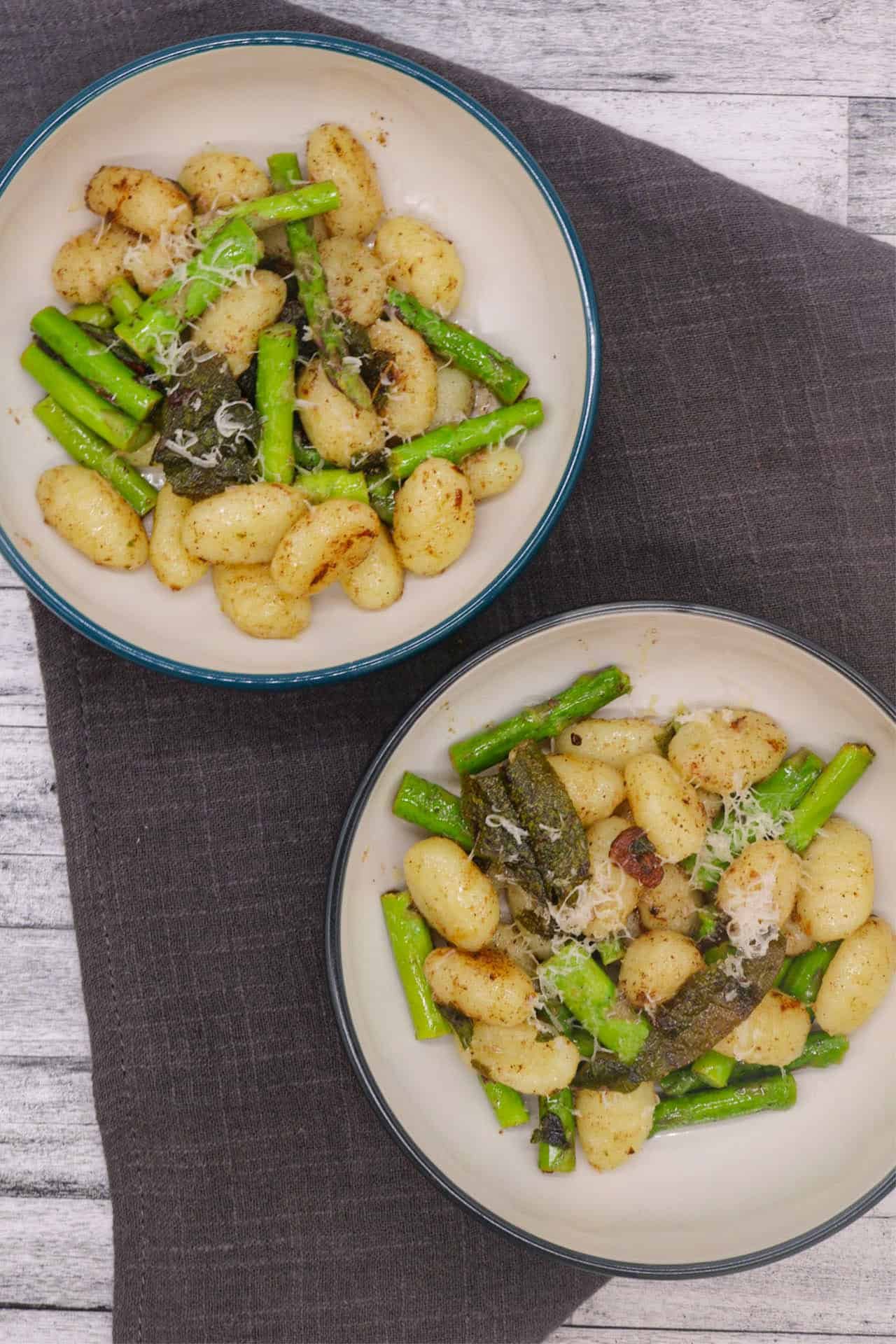 Gnocchi with asparagus, sage and lemon butter in bowls