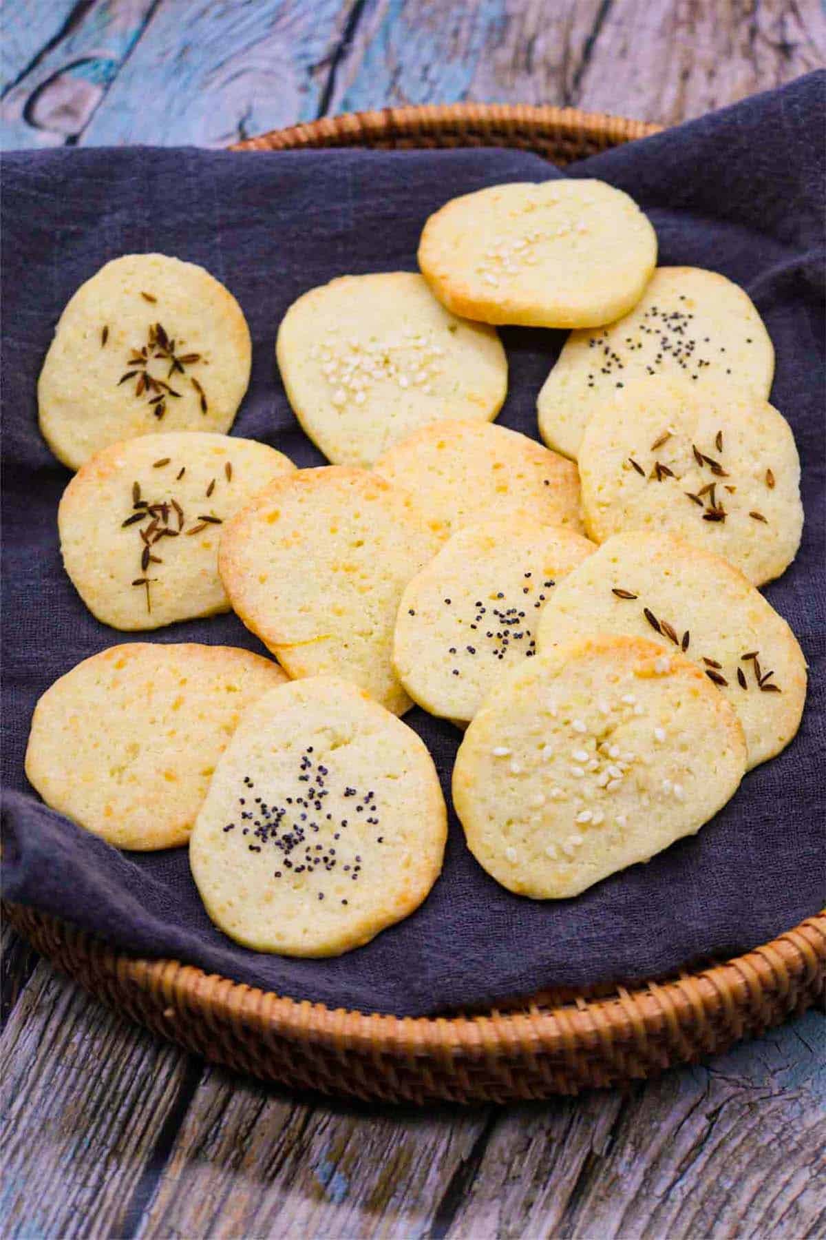Cheese crackers in basket with grey towel