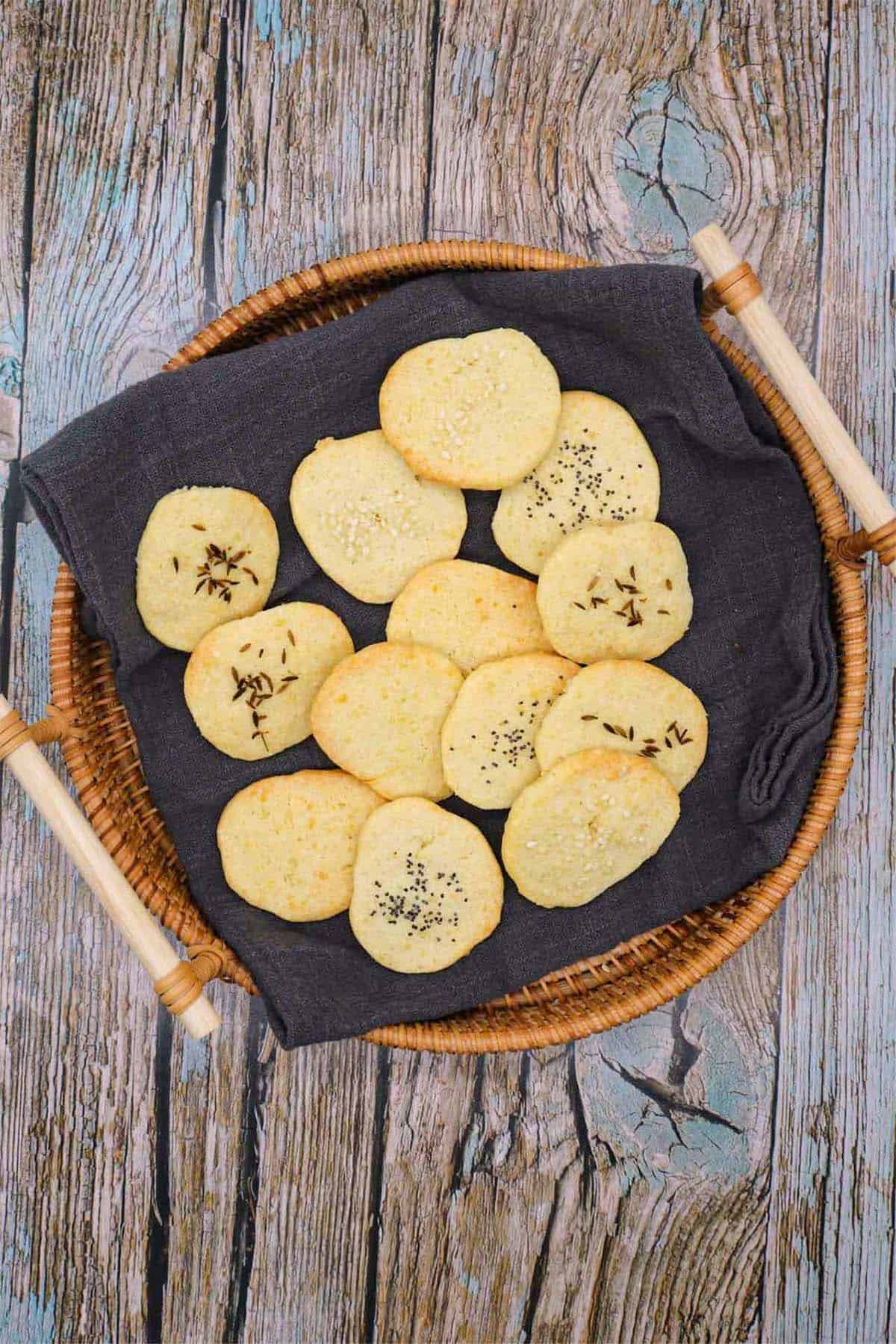Cheese crackers in basket with grey towel