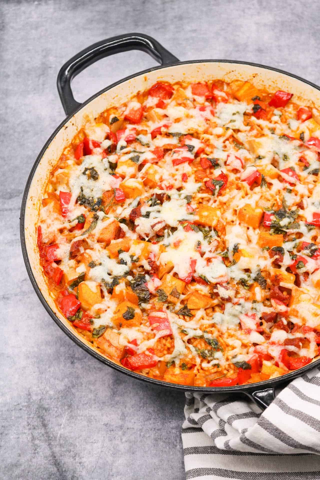 Chorizo squash rice with manchego in large round casserole