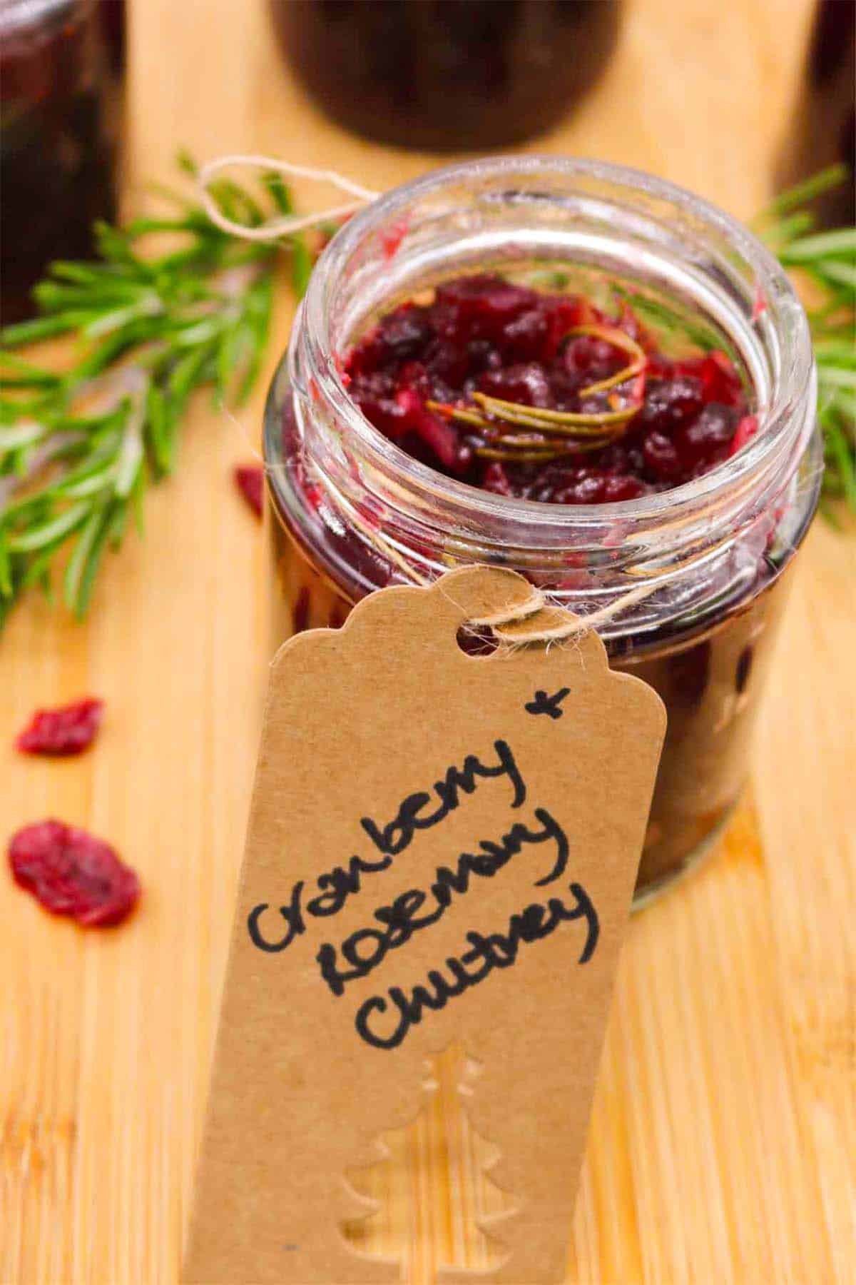 Jar of cranberry and rosemary jam with gift label