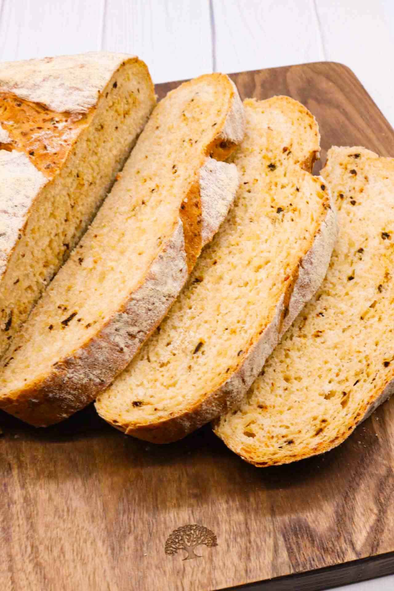 Sliced Halloumi chipotle loaf on wooden board