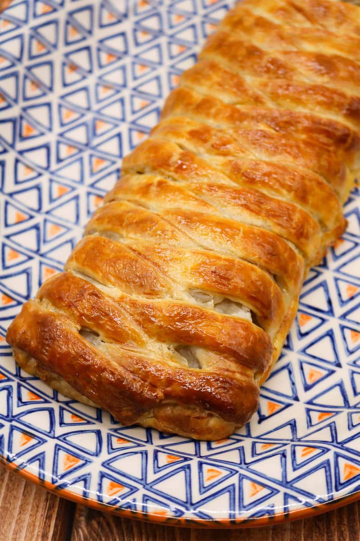 Plaited pork pie on oval serving platter
