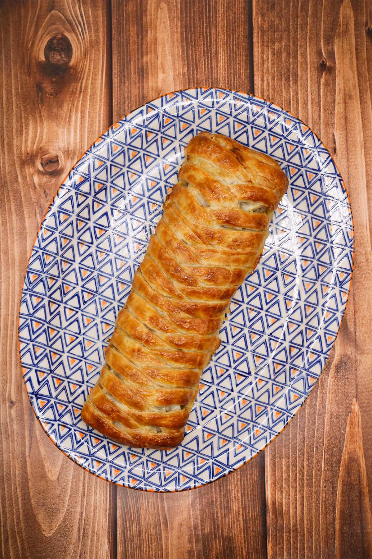 Plaited pork pie on oval serving platter