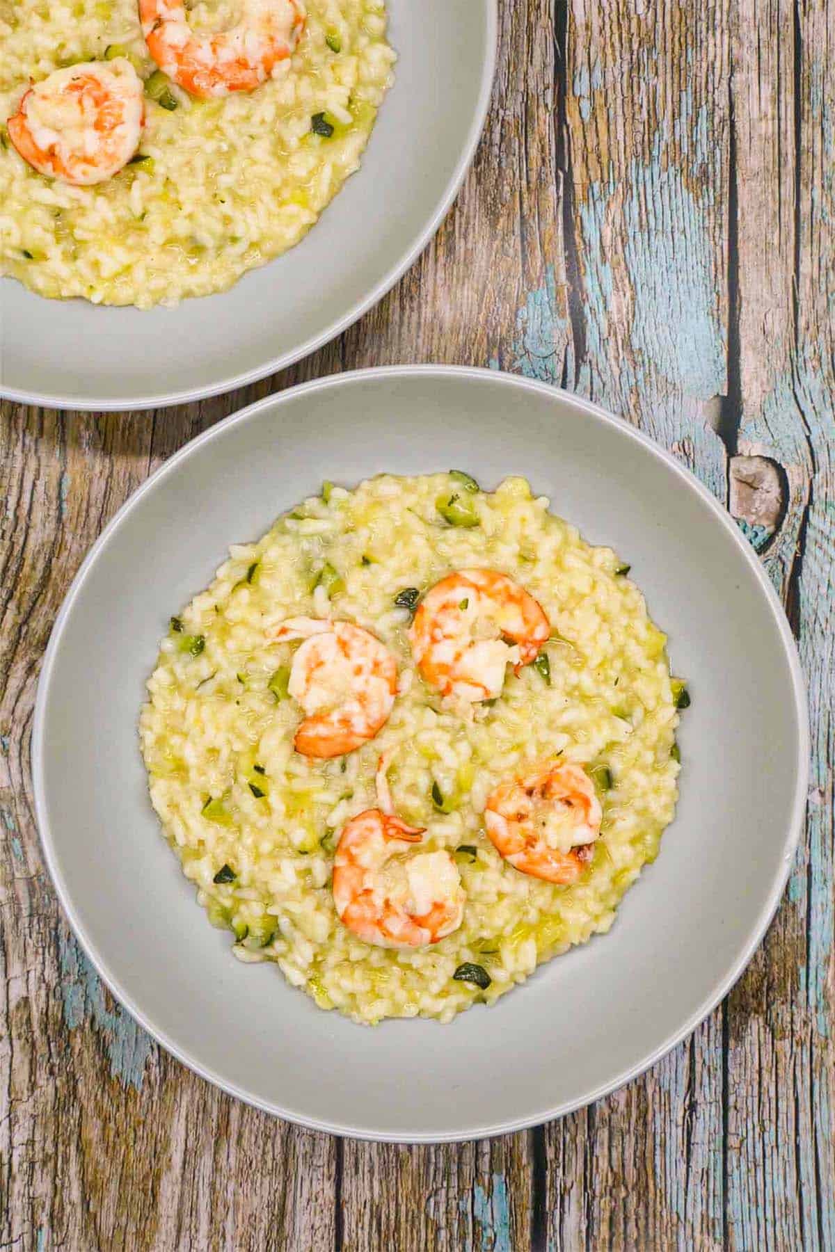 prawn and courgette risotto in grey bowls