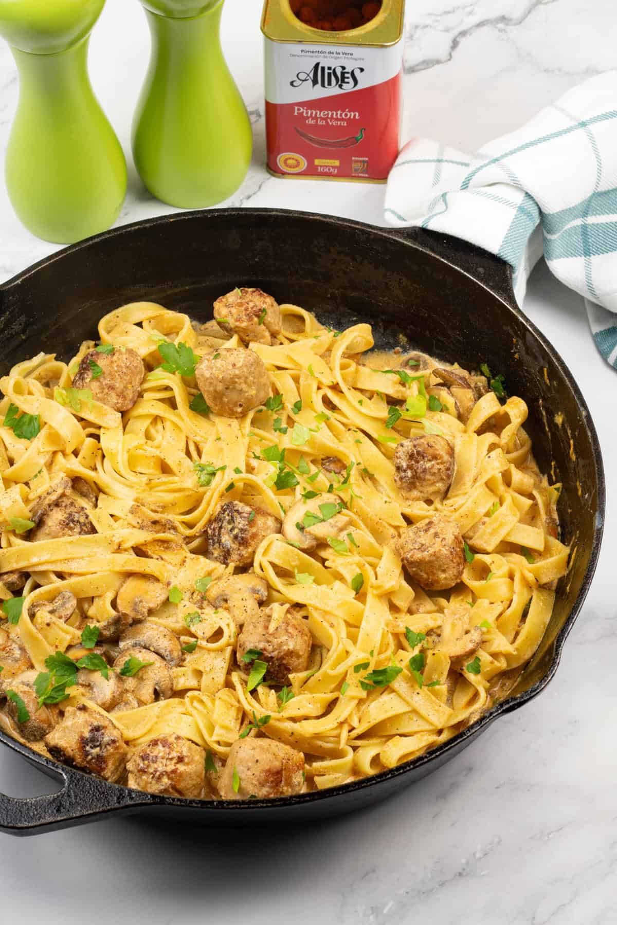 Speedy sausage stroganoff tagliatelle in a skillet.