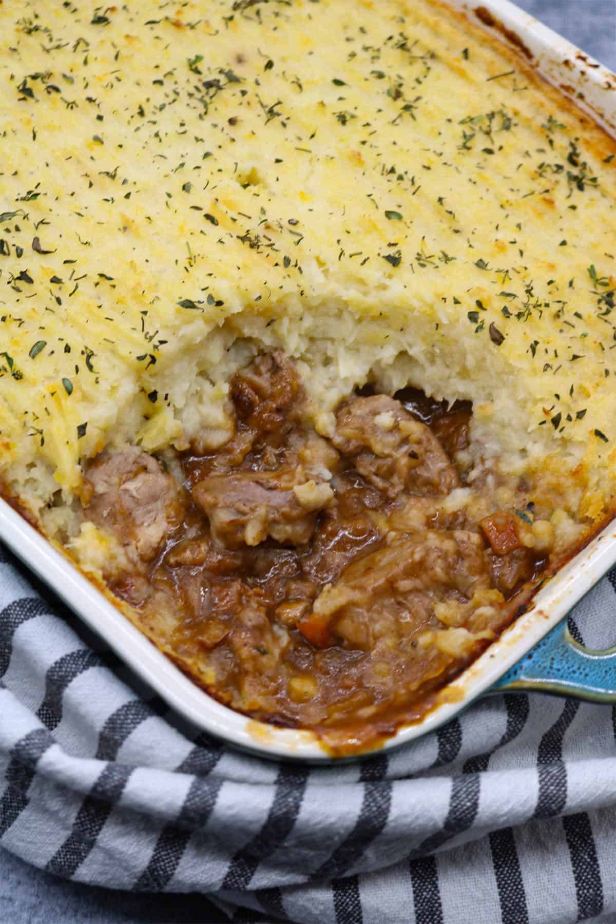 Gamekeeper pin rectangle oven dish with black and white towel underneath