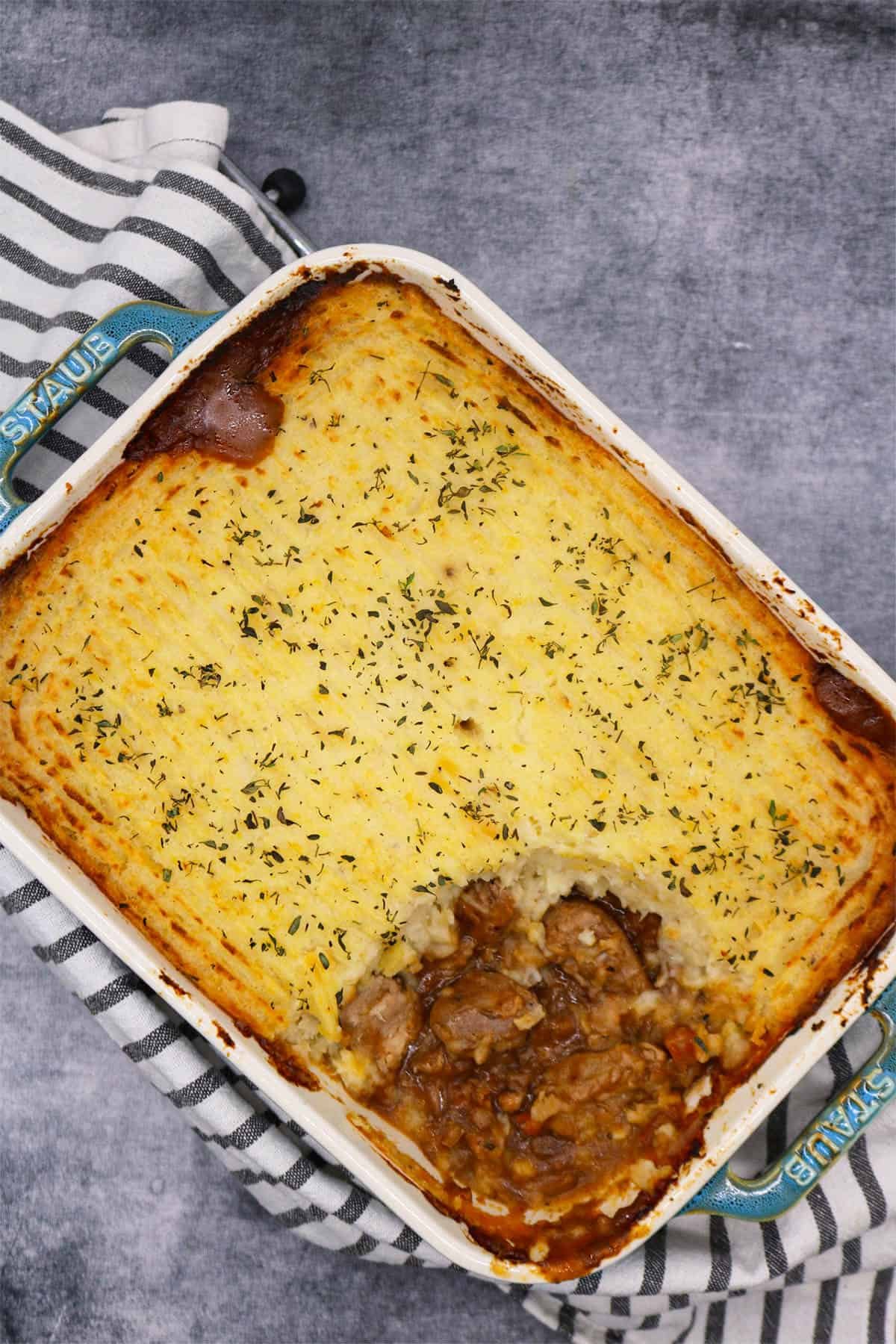 Gamekeeper pin rectangle oven dish with black and white towel underneath