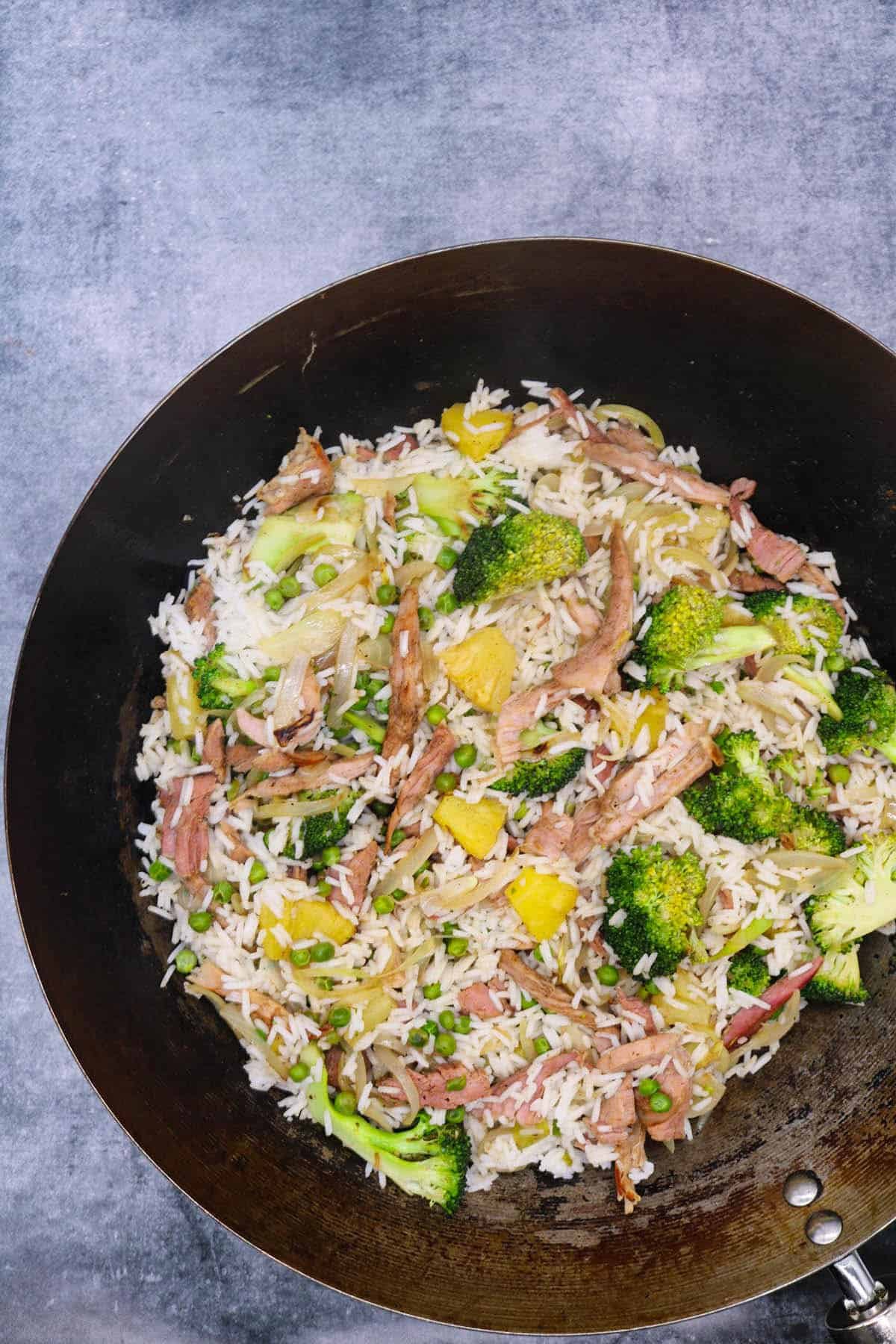 Gammon and pineapple rice in wok