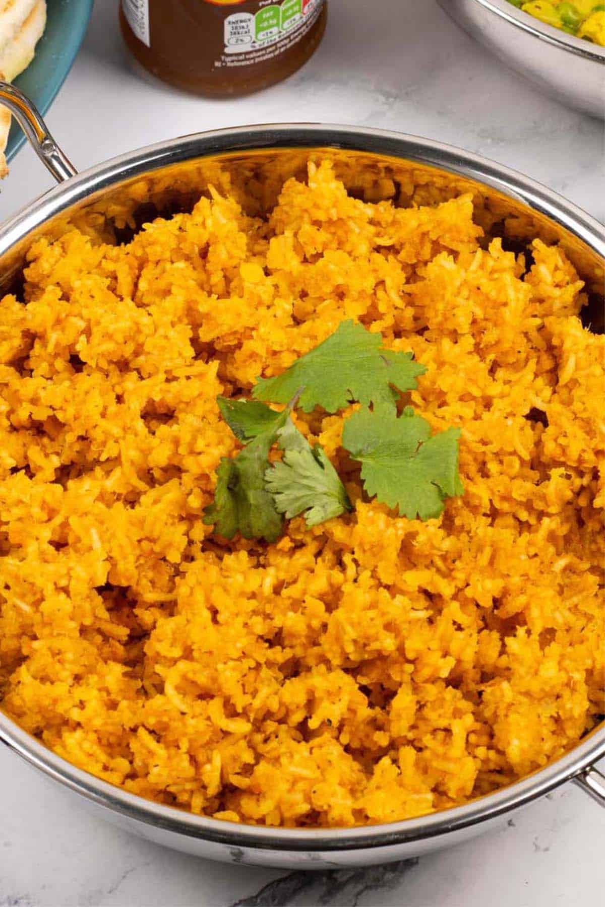 Red lentils and rice in a balti dish.