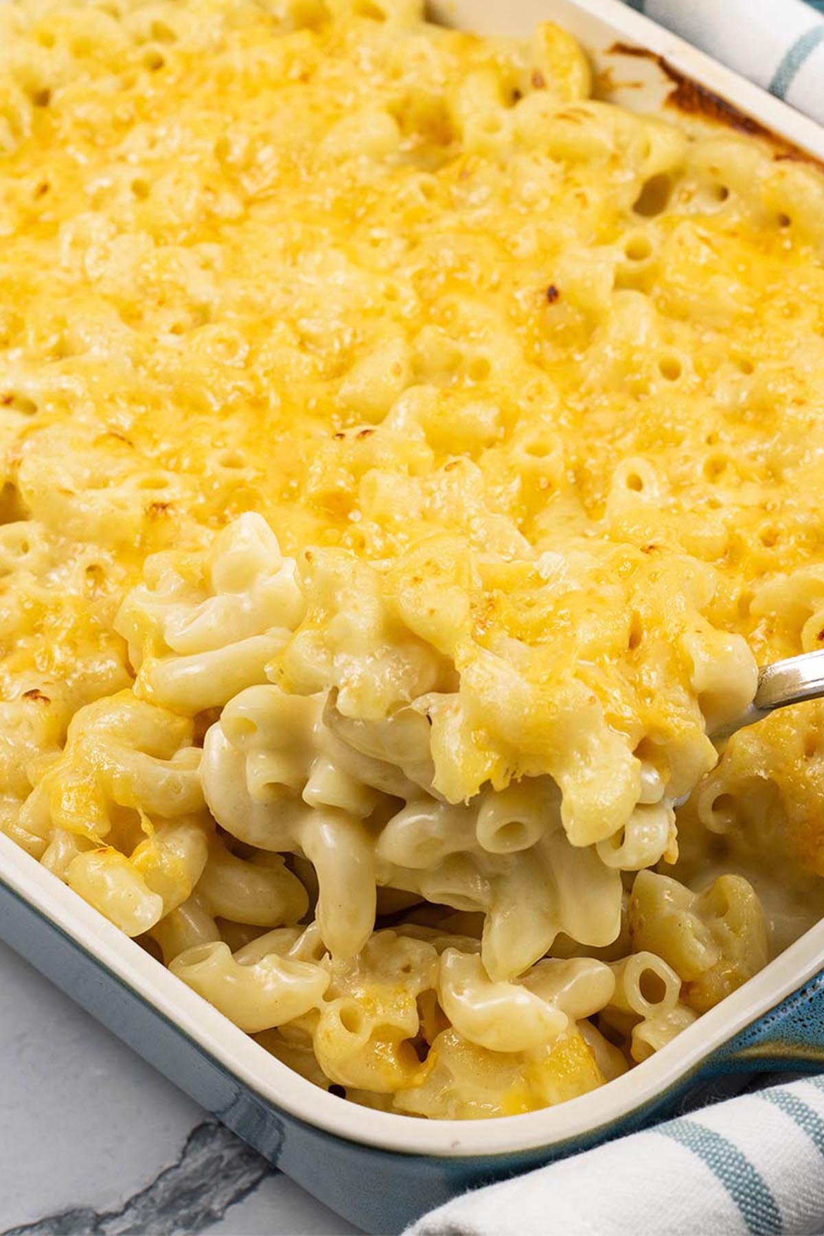 Macaroni cheese in a rectangular Staub dish.