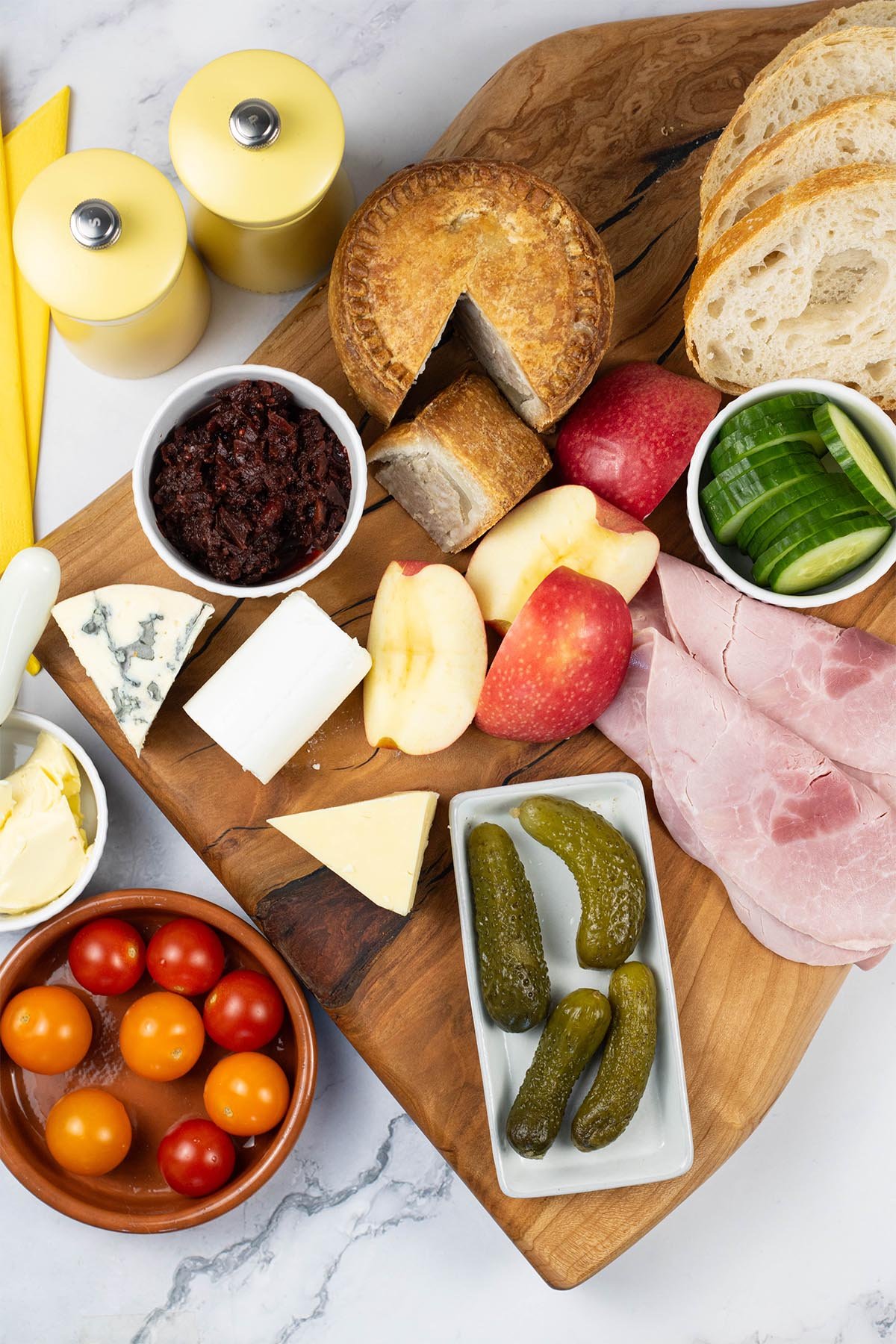Ploughman's platter for 2 on a wooden presentation board.