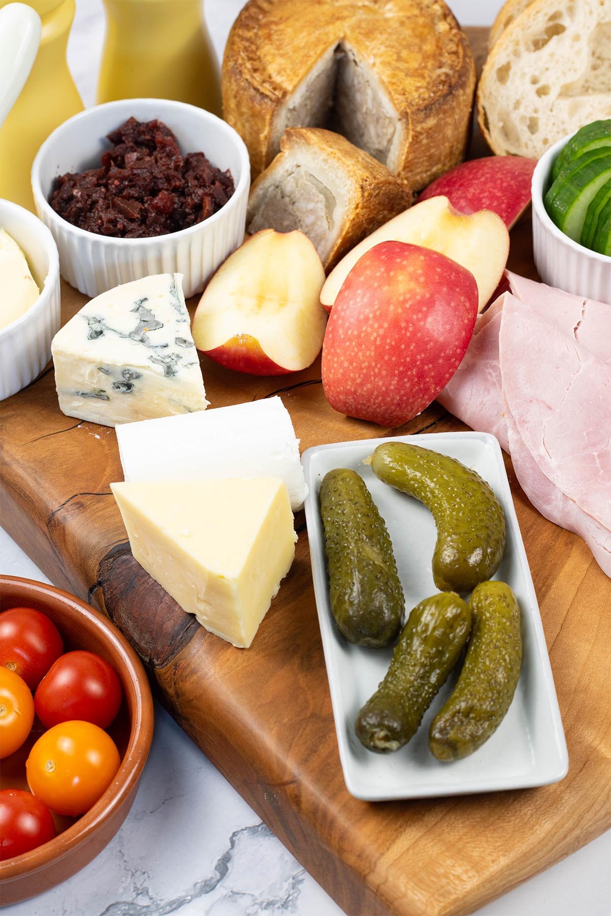Ploughman's platter for 2 on a wooden presentation board.