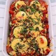 Courgette and tomato gratin in rectangle oven dish