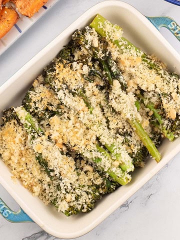 Roast tenderstem broccoli with parmesan and pine nut crumb in a Staub dish with za'atar carrots on the side.