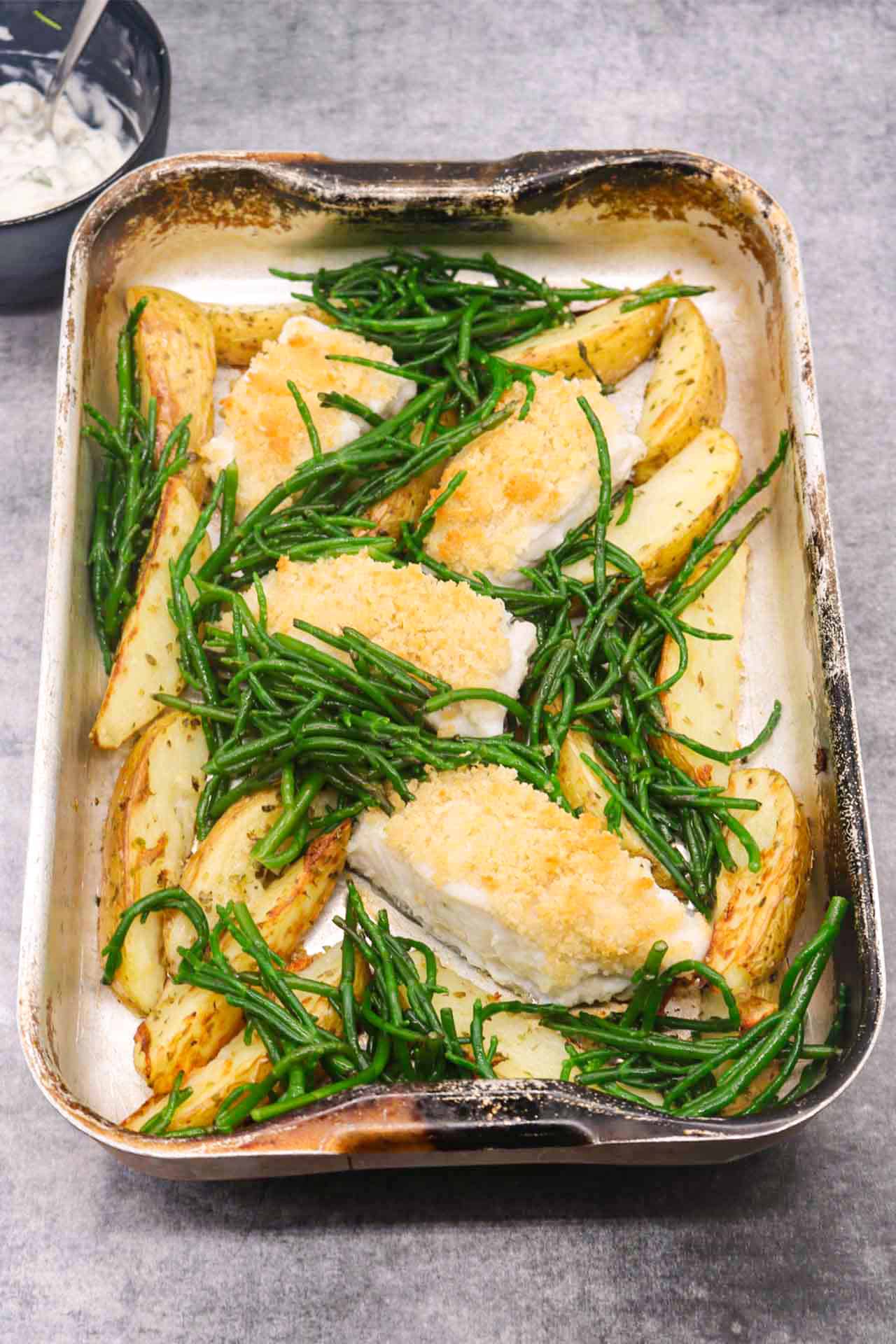 Posh fish and chunky chips in roasting tin with samphire