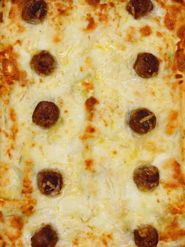 Three cheese meatball lasagne in large rectangular Staub dish