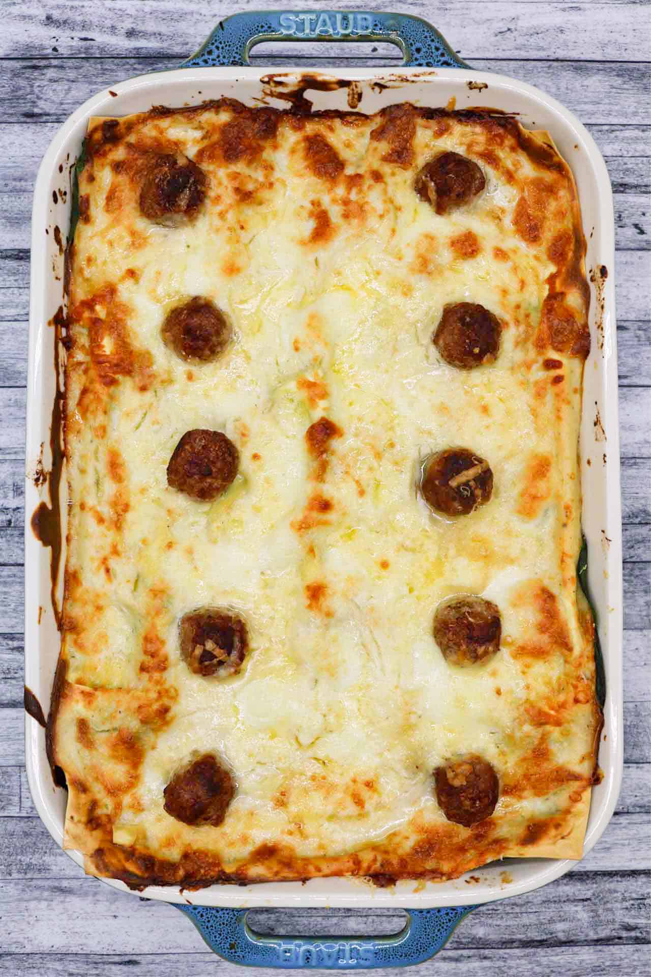 Three cheese meatball lasagne in large rectangular Staub dish