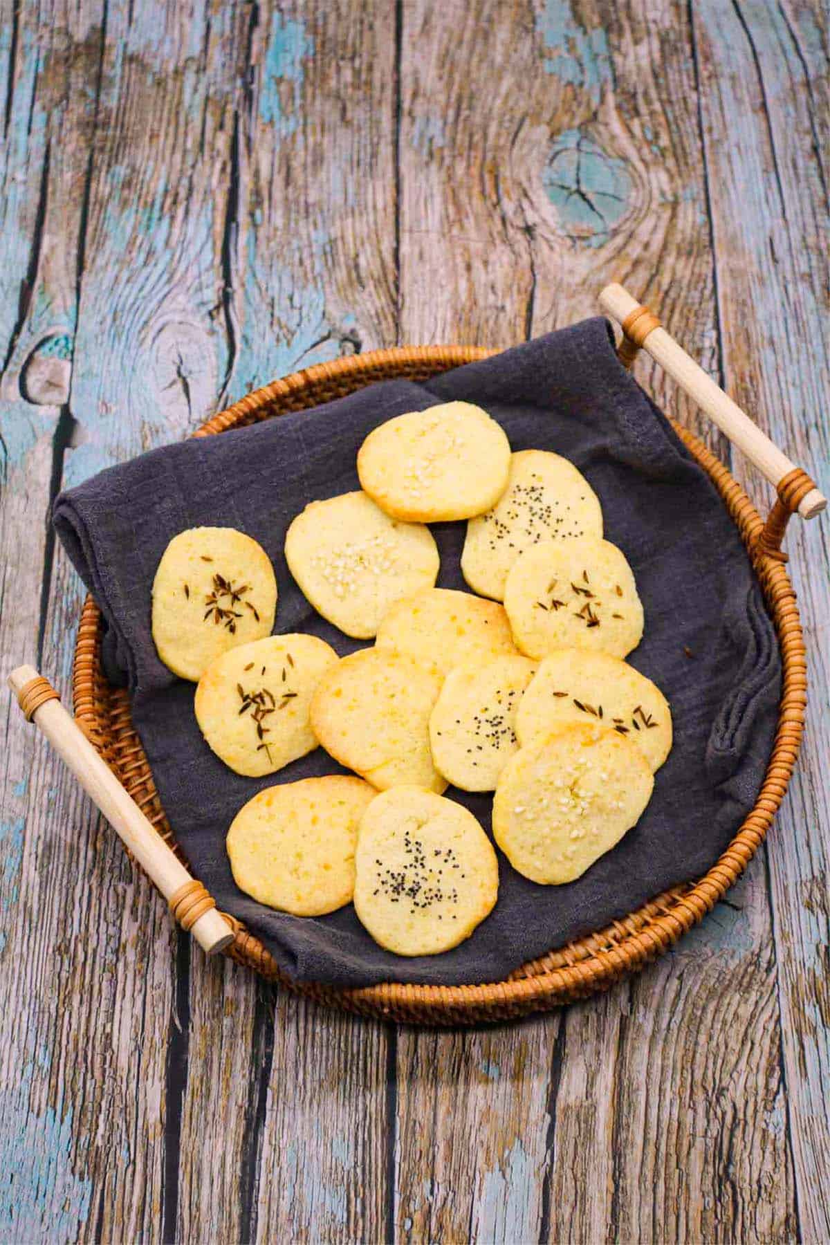 Cheese crackers in basket with grey towel