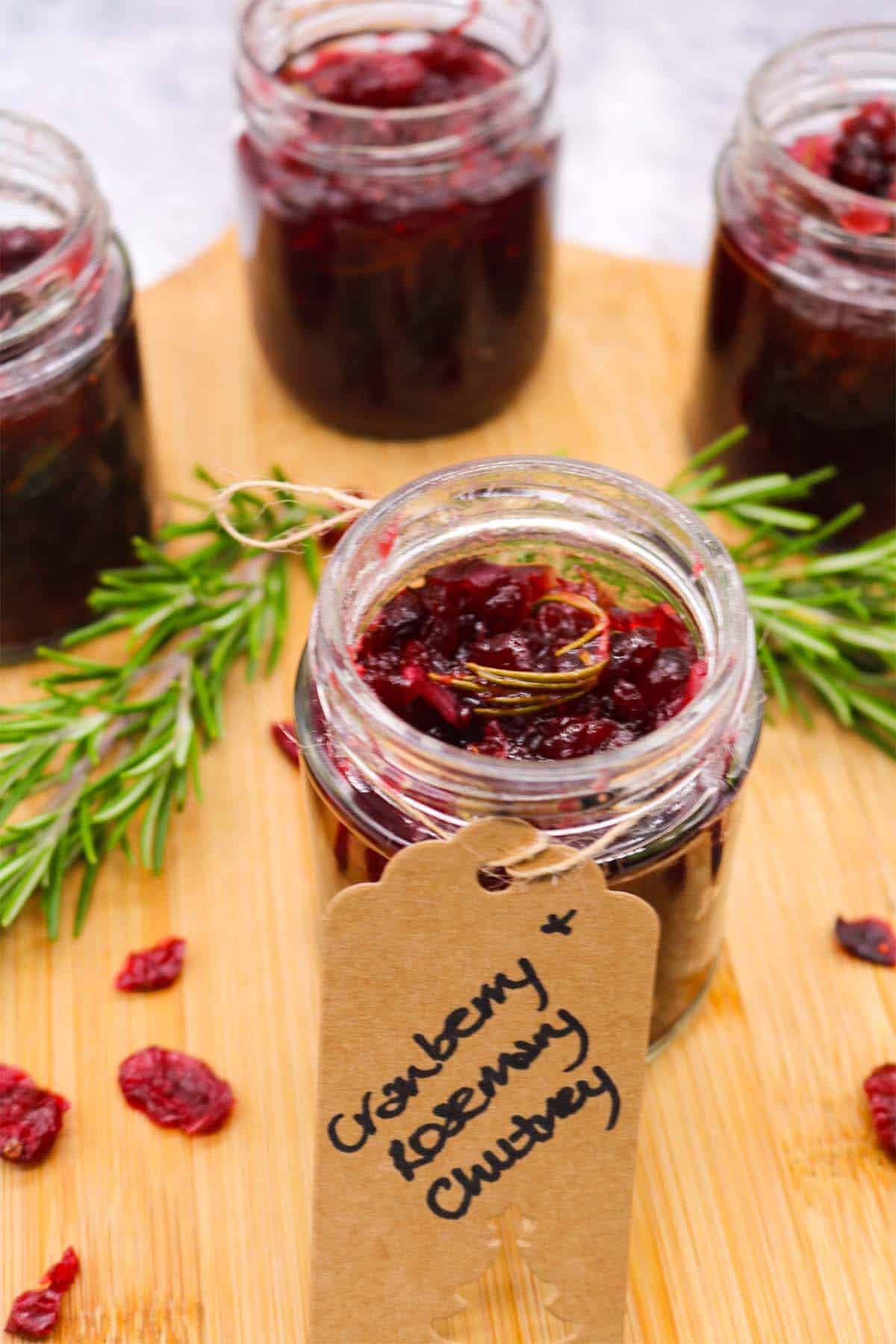 Jar of cranberry and rosemary jam with gift label