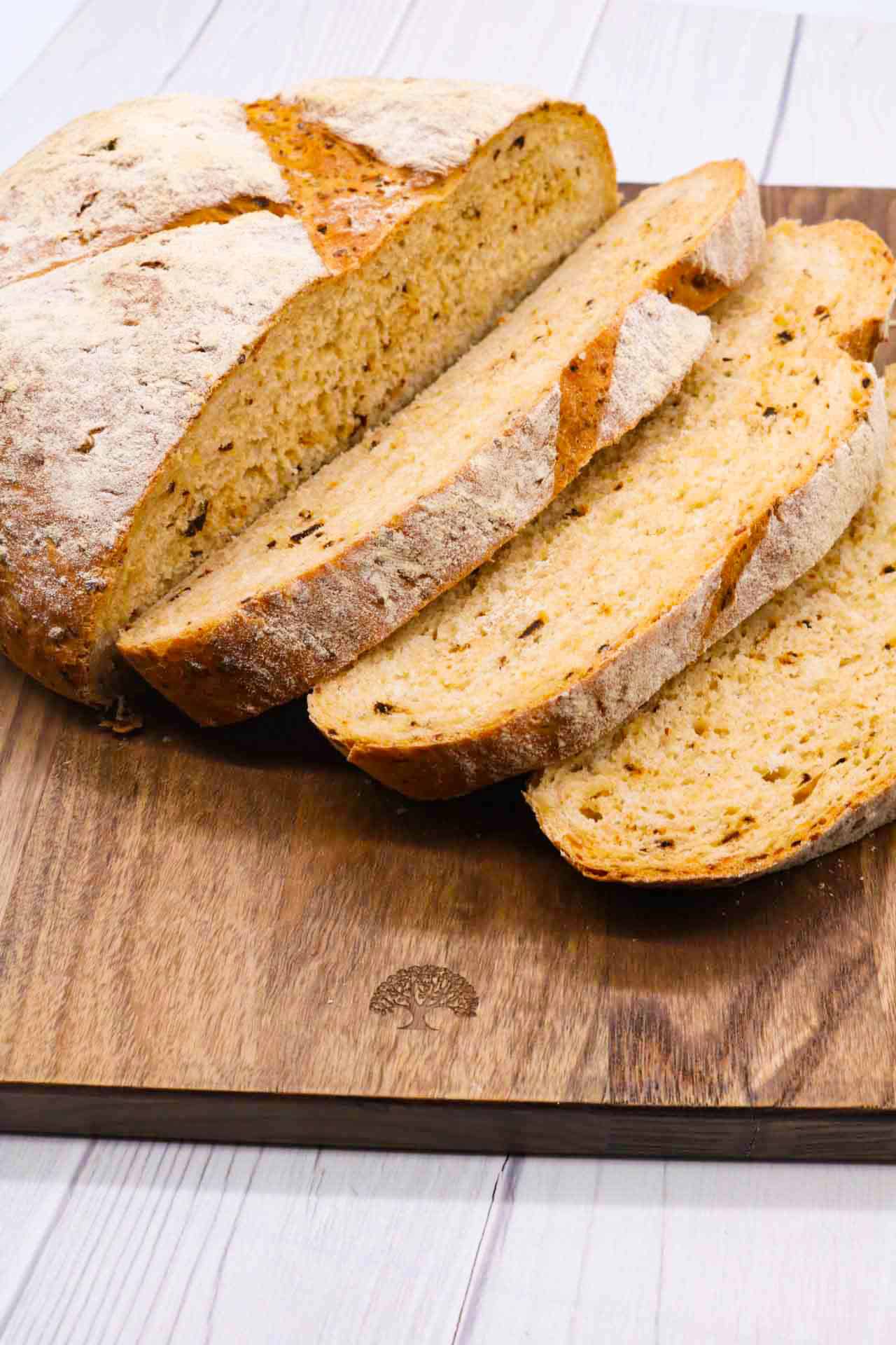 Sliced Halloumi chipotle loaf on wooden board
