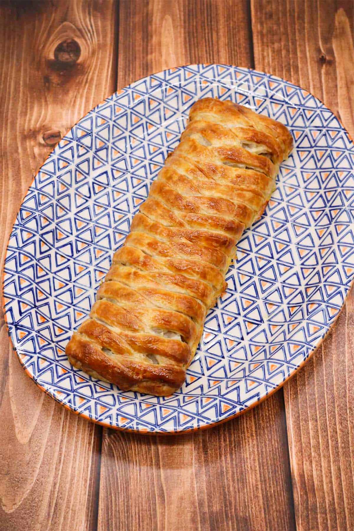 Plaited pork pie on oval serving platter