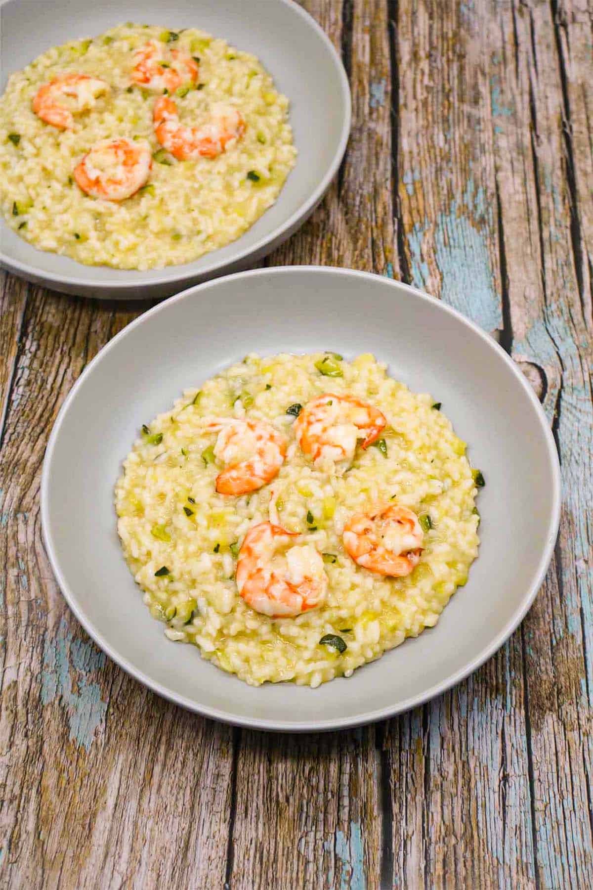 prawn and courgette risotto in grey bowls