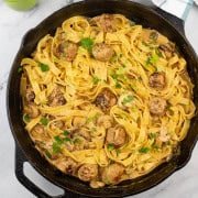 Speedy sausage stroganoff tagliatelle in a skillet.