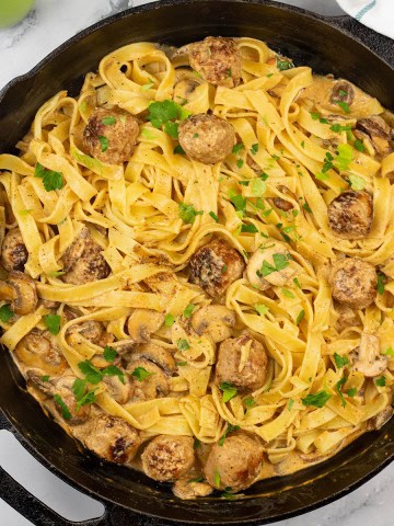 Speedy sausage stroganoff tagliatelle in a skillet.