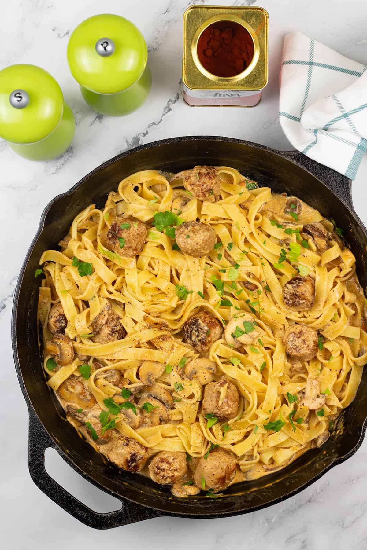 Speedy sausage stroganoff tagliatelle in a skillet.