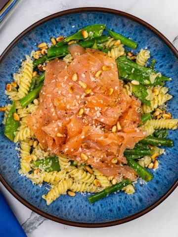 Quick and easy smoked salmon pasta in a blue patterned bowl.