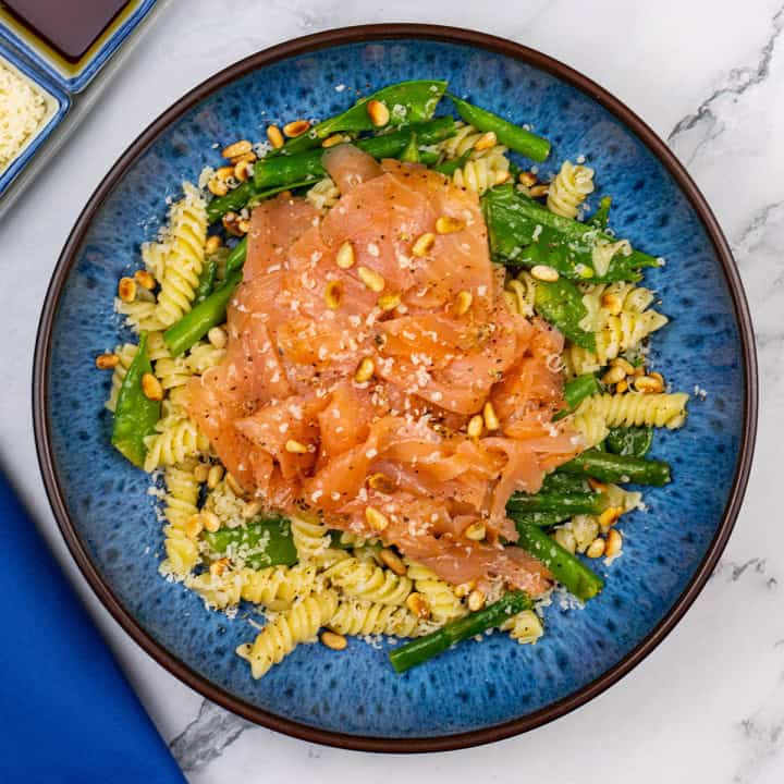 Quick and easy smoked salmon pasta in a blue patterned bowl.