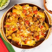 Smoky chicken fajita nachos in a stoneware dish.