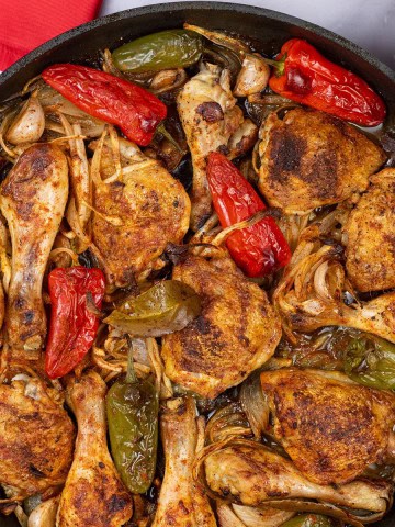 Paprika roast chicken in a large frying pan.