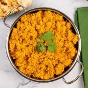 Red lentils and rice in a balti dish.