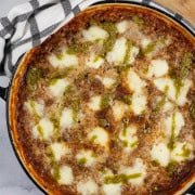Risotto bolognese in a large shallow round casserole dish.