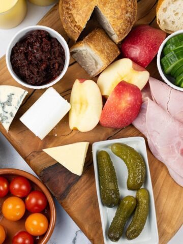 Ploughman's platter for 2 on a wooden presentation board.